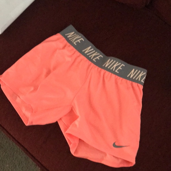 peach color nike shorts